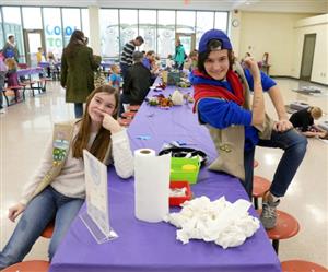 Girl Scouts helping at the fingerstache station